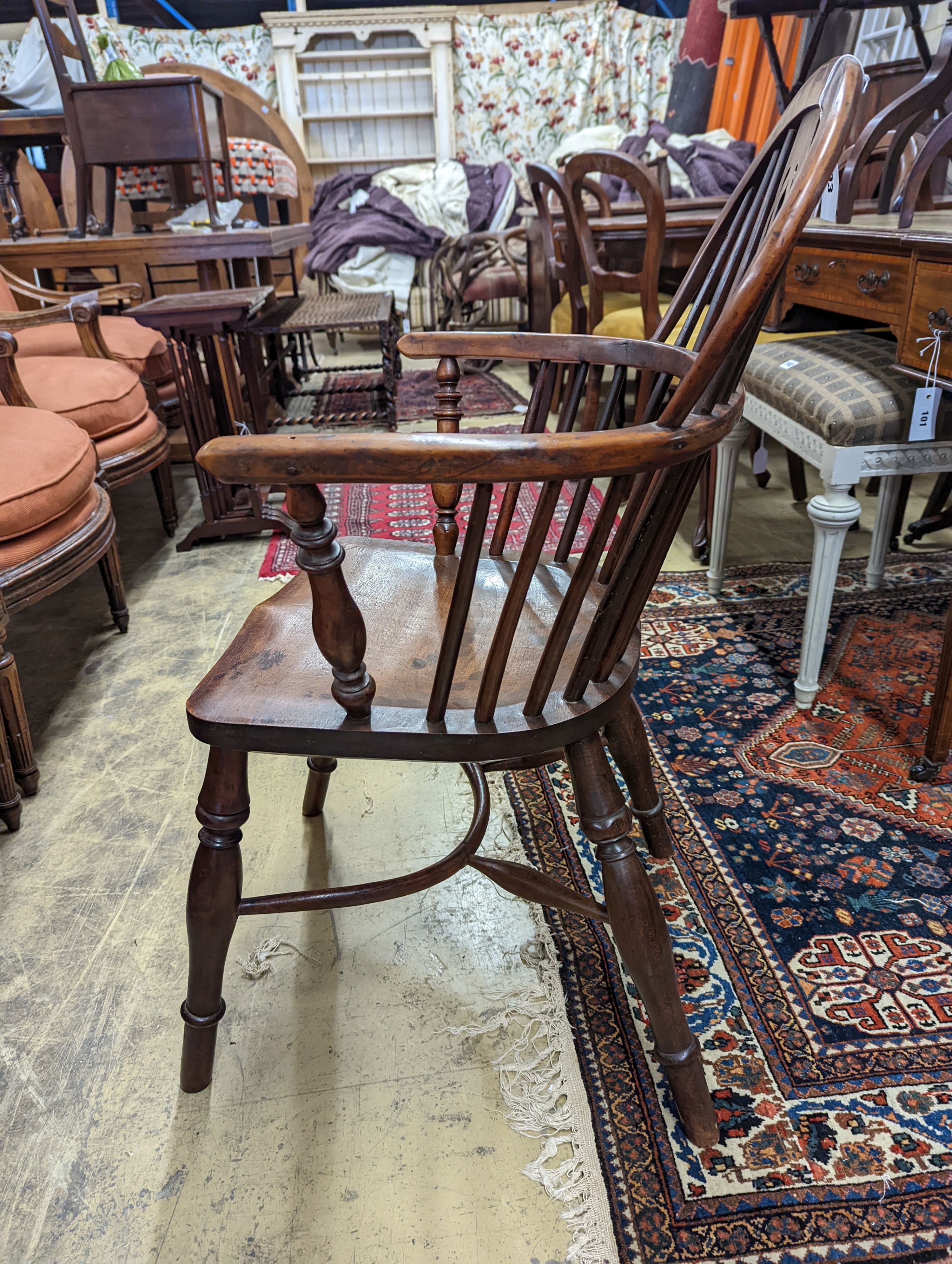 A mid 19th century Windsor yew and elm Windsor elbow chair, width 58cm, depth 42cm, height 91cm